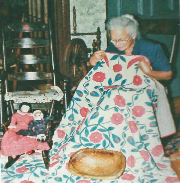 Marjorie inspecting a quilt
